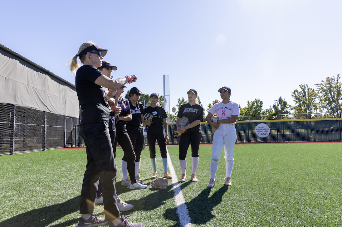 SJCC softball head coach Debbie Huntze-Rooney (left) discusses drill with student-athletes at an Oct. 23 practice